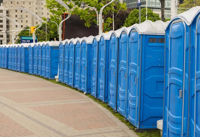 a row of portable restrooms at a fairground, offering visitors a clean and hassle-free experience in orange